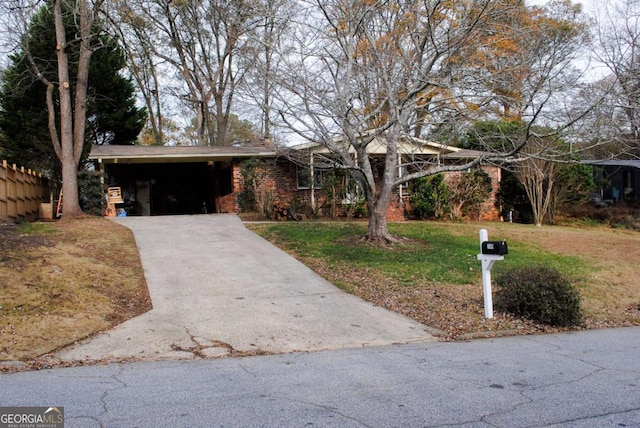 ranch-style house with a front lawn and a carport