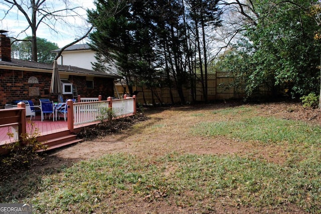 view of yard with a wooden deck