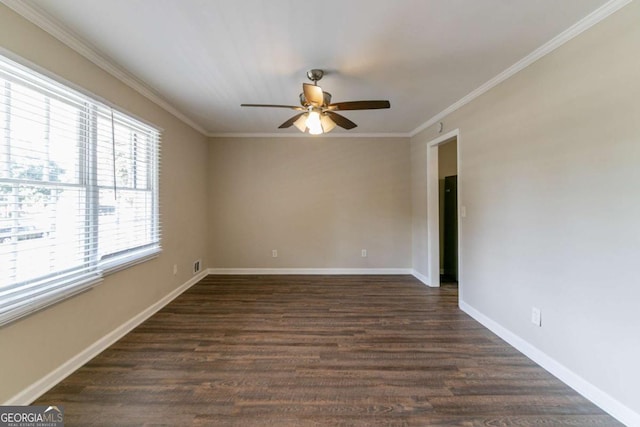 spare room with ceiling fan, crown molding, and dark hardwood / wood-style floors