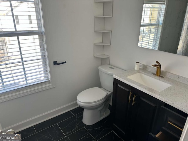 bathroom with toilet and vanity