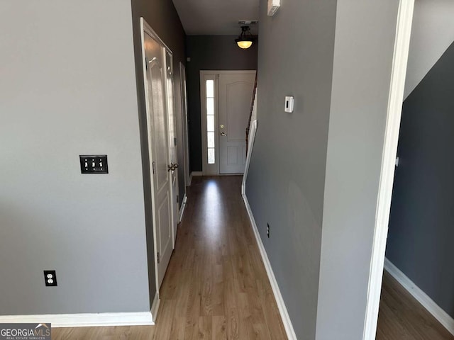 hall with light wood-type flooring