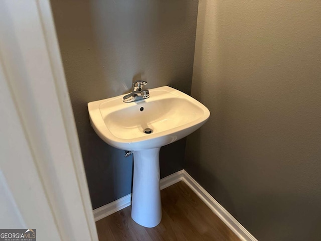 bathroom with wood-type flooring