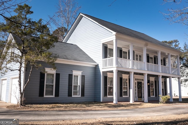 view of front of home with a balcony and covered porch