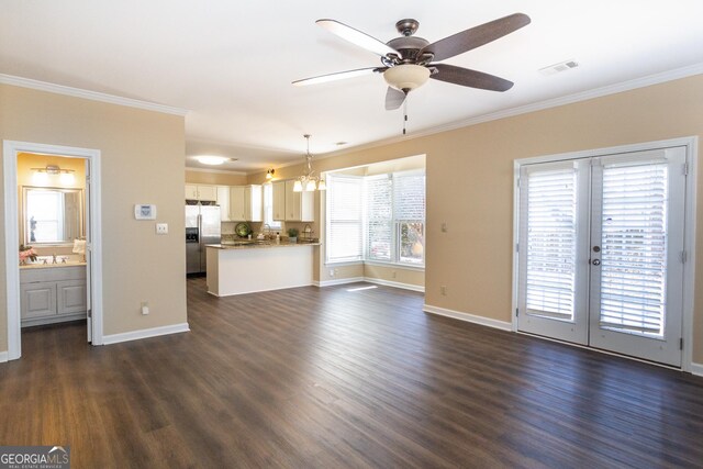 unfurnished living room featuring french doors, ceiling fan, ornamental molding, and dark hardwood / wood-style flooring