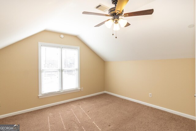 bonus room featuring lofted ceiling, carpet floors, and ceiling fan