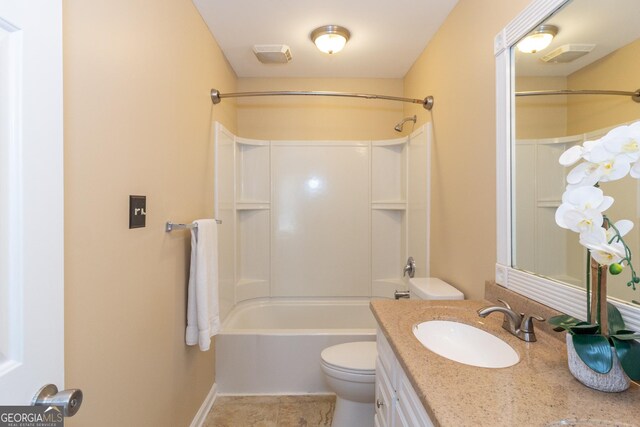 full bathroom with toilet, vanity, and tub / shower combination