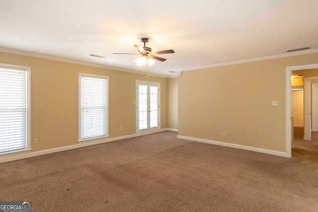 carpeted empty room featuring ornamental molding and ceiling fan