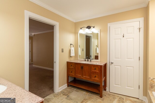 bathroom with a tub, crown molding, and vanity