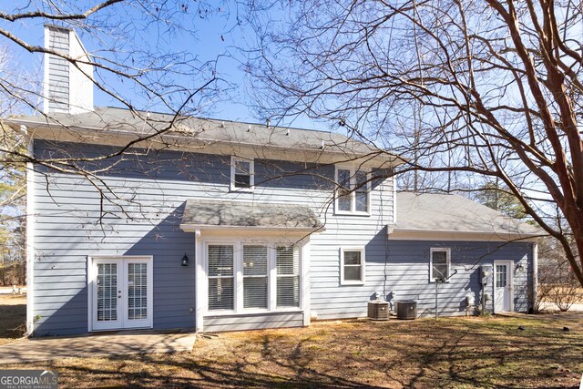 back of house with french doors and central air condition unit