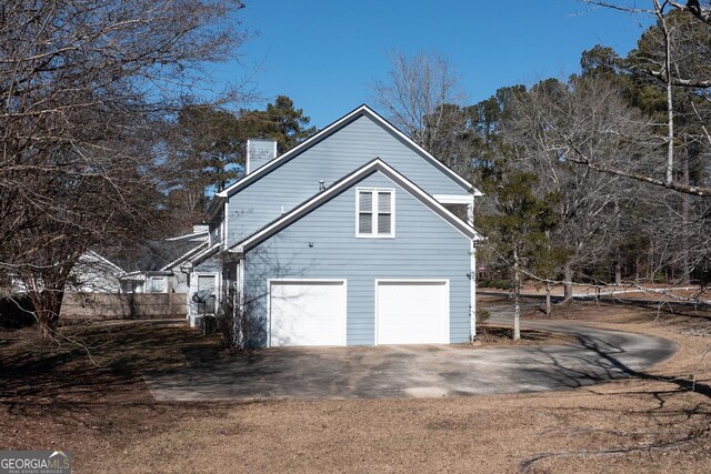 view of side of property featuring a garage