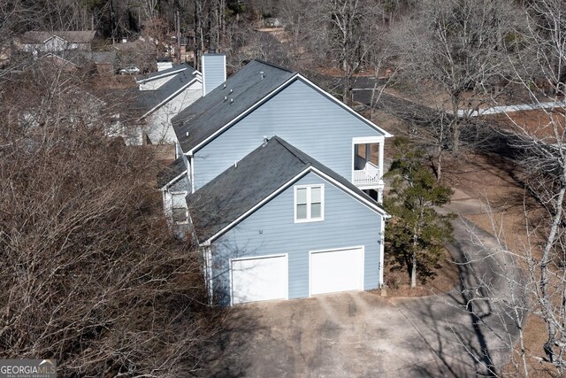 view of property exterior with a garage