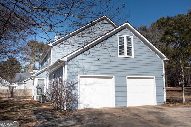 view of property exterior with a garage