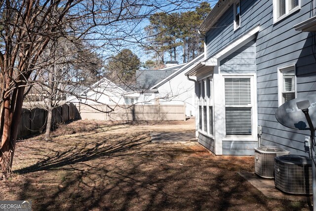 view of yard with central air condition unit