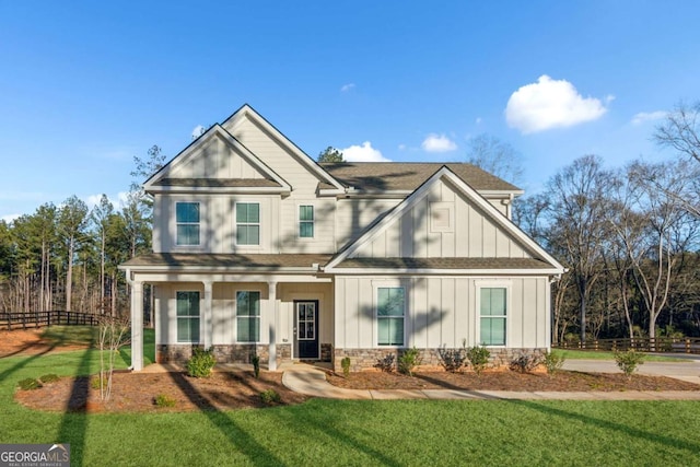 craftsman house with a front lawn