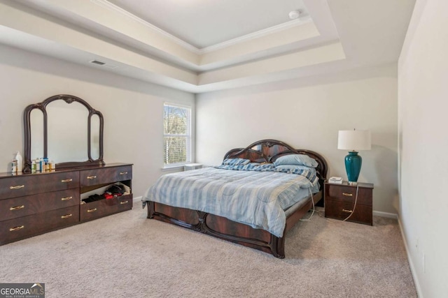 bedroom featuring crown molding, a raised ceiling, and light colored carpet