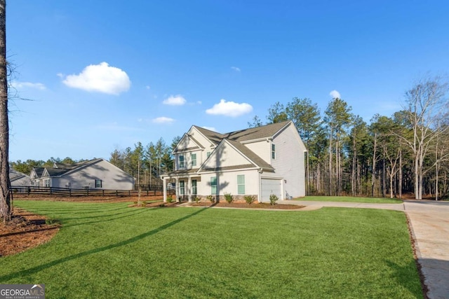 exterior space featuring a lawn and a garage