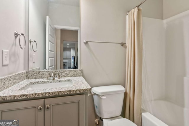 full bathroom featuring toilet, shower / bath combination with curtain, and vanity