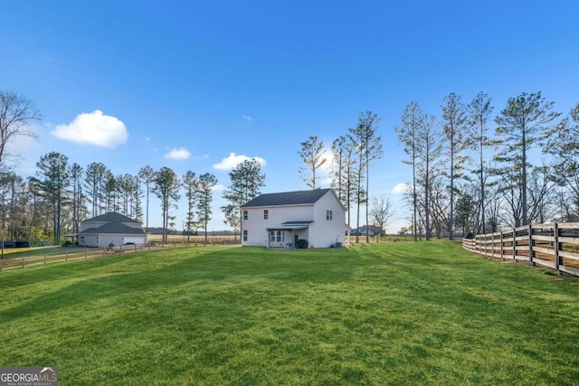 view of yard with a rural view