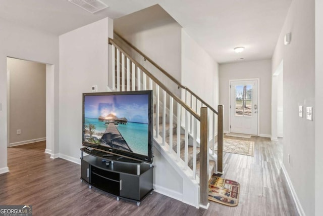 foyer entrance with dark wood-type flooring