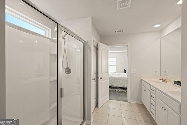 bathroom with walk in shower, plenty of natural light, and tile patterned flooring