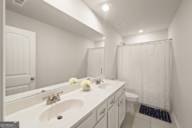 bathroom with vanity, toilet, tile patterned floors, and a shower with curtain