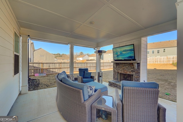 view of patio featuring an outdoor living space with a fireplace