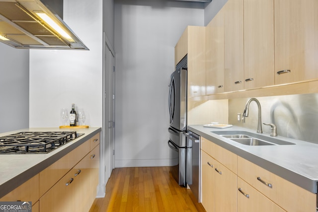 kitchen featuring sink, stainless steel appliances, island exhaust hood, and light brown cabinets