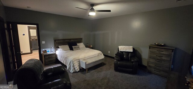 bedroom with ceiling fan and baseboards