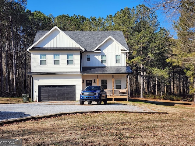 modern farmhouse style home featuring metal roof, an attached garage, roof with shingles, board and batten siding, and a standing seam roof