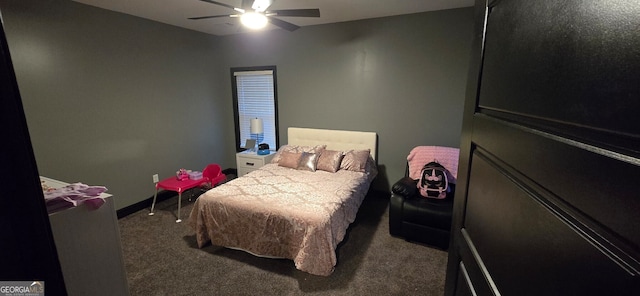 bedroom with ceiling fan, carpet flooring, and baseboards