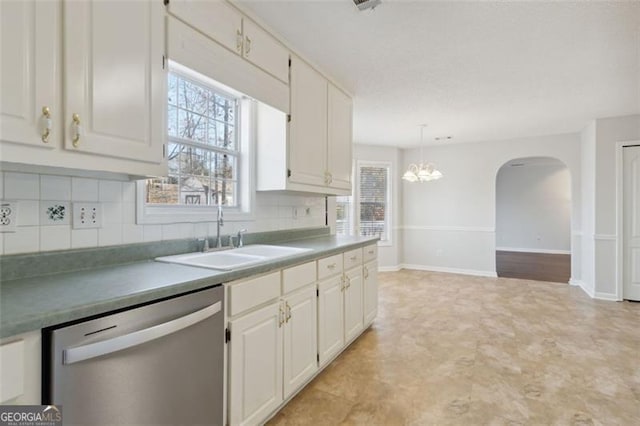 kitchen with white cabinets, dishwasher, and sink