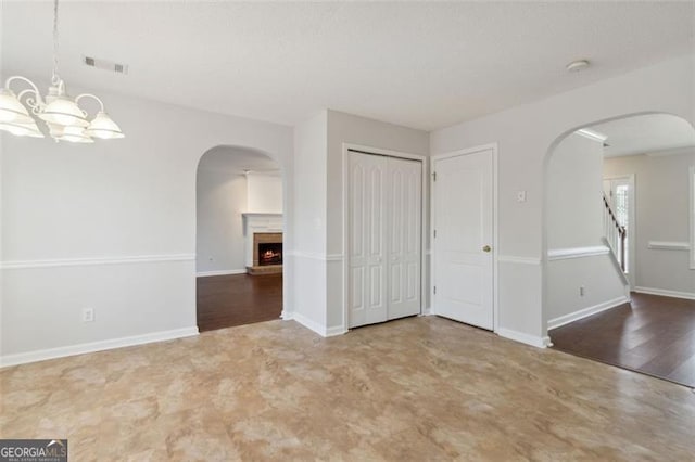 empty room featuring a notable chandelier