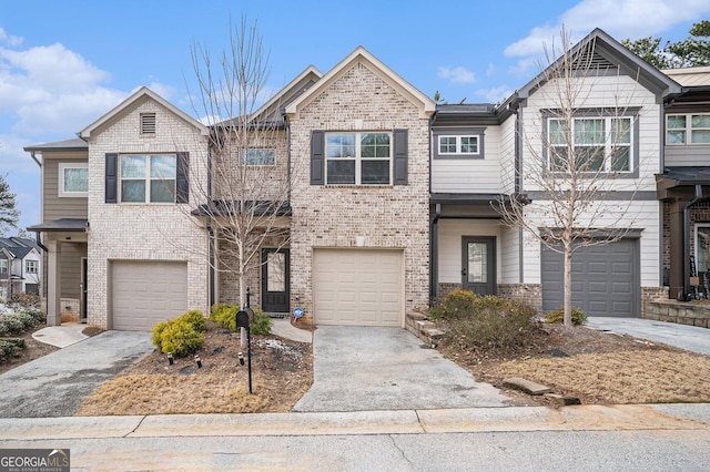 townhome / multi-family property featuring a garage