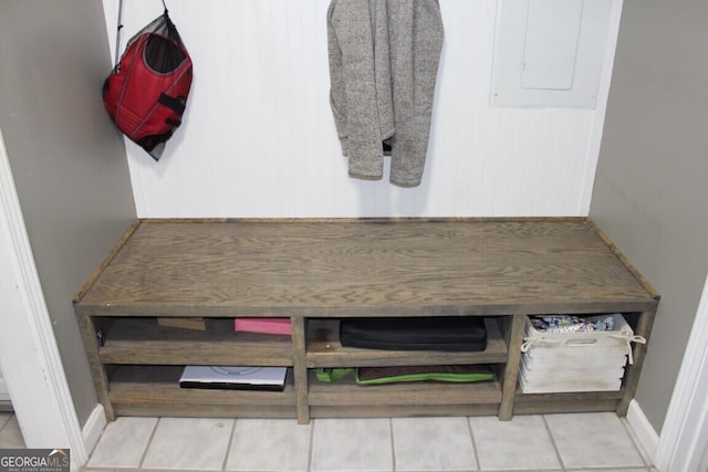 mudroom with light tile patterned floors and electric panel