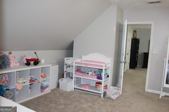 playroom with light carpet and lofted ceiling