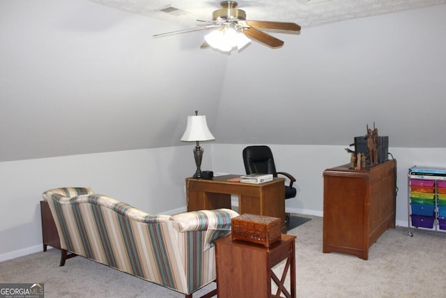 office space featuring ceiling fan and light colored carpet