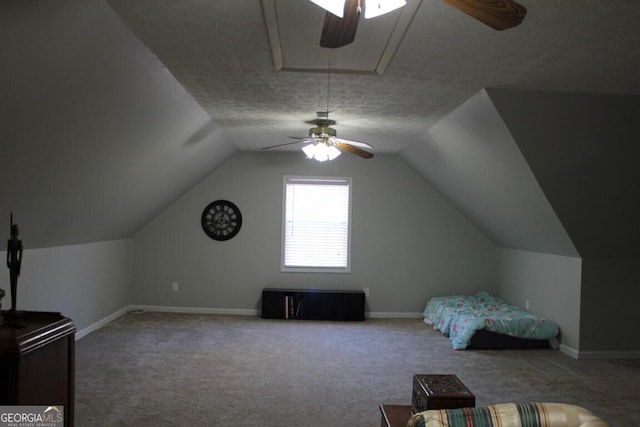 additional living space with a textured ceiling, ceiling fan, lofted ceiling, and carpet floors