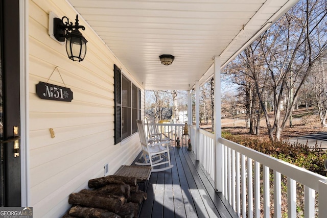 wooden deck featuring covered porch