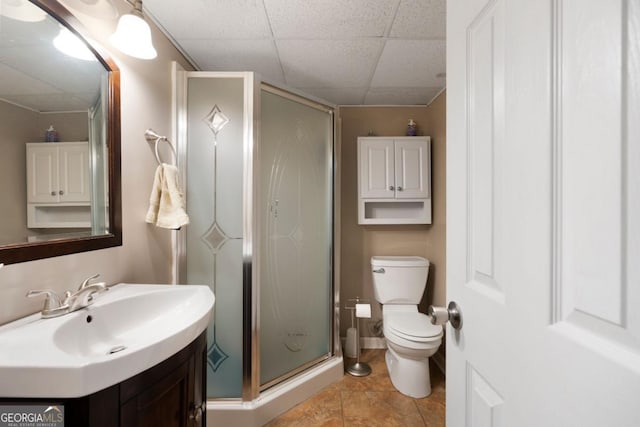 bathroom with sink, toilet, and a shower with shower door