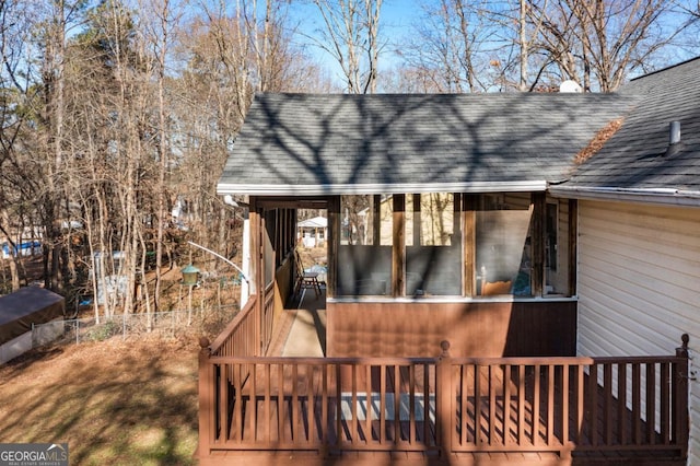 view of side of home with a deck