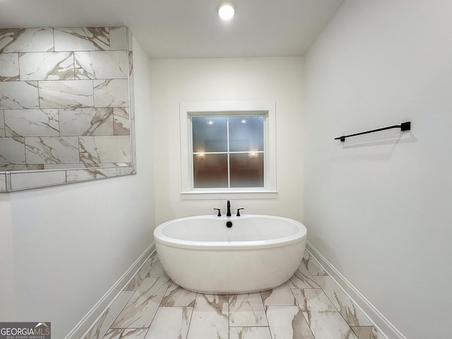 bathroom featuring a tub to relax in