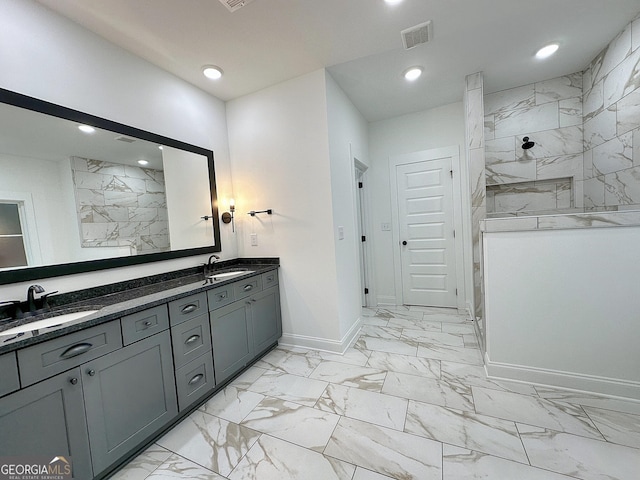 bathroom featuring walk in shower and vanity