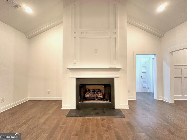 unfurnished living room featuring dark wood-type flooring and high vaulted ceiling