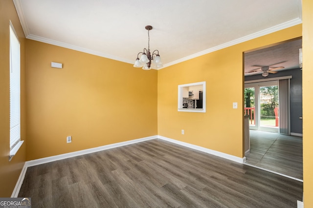 unfurnished room featuring ceiling fan with notable chandelier, crown molding, and dark hardwood / wood-style flooring