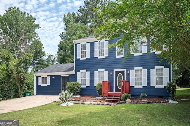 colonial-style house with a front lawn