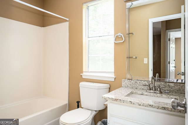 full bathroom featuring toilet, vanity, and  shower combination