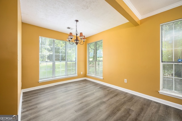 unfurnished dining area featuring wood-type flooring, a textured ceiling, an inviting chandelier, and beam ceiling