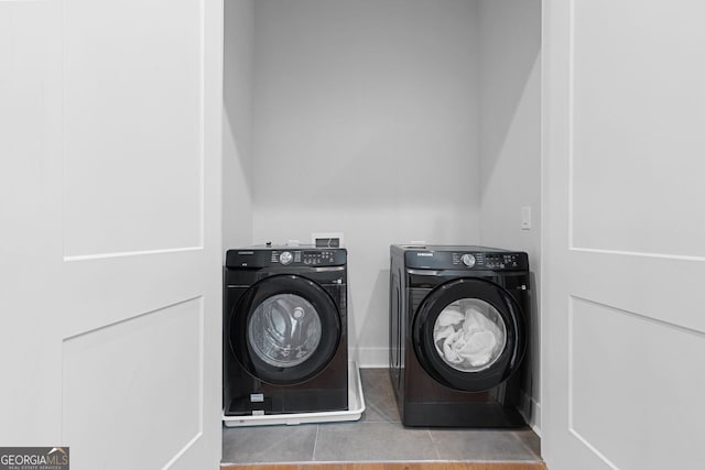 washroom featuring independent washer and dryer and tile patterned flooring