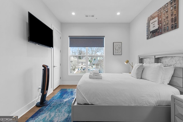 bedroom featuring hardwood / wood-style flooring