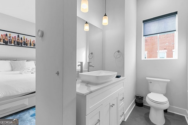 bathroom featuring toilet and vanity